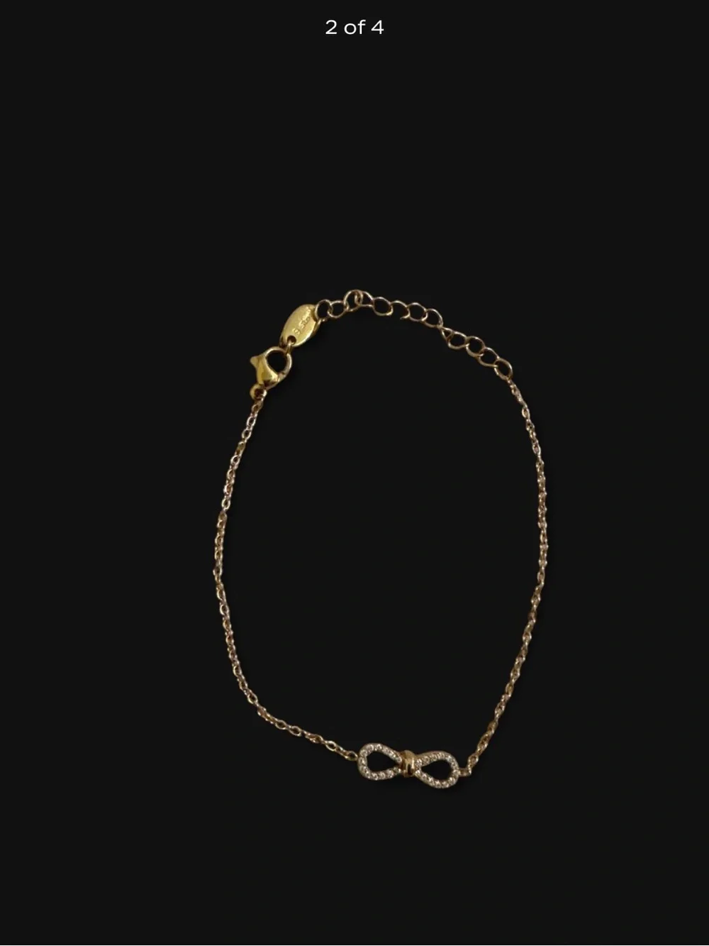 Stainless Steel Gold Infinity Bracelet With Rhinestones.